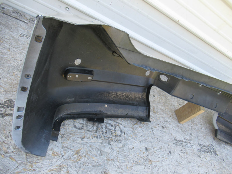 2008-2015 NISSAN ARMADA REAR BUMPER COVER PANEL PANEL 85022-ZQ00A OEM
