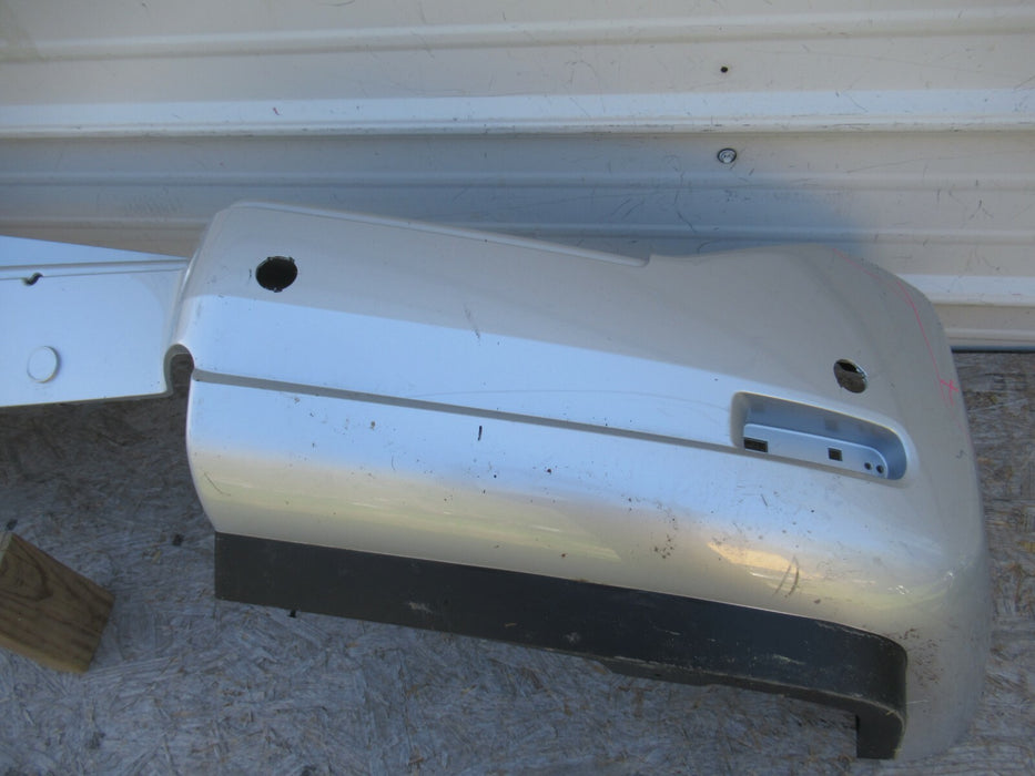 2008-2015 NISSAN ARMADA REAR BUMPER COVER PANEL PANEL 85022-ZQ00A OEM