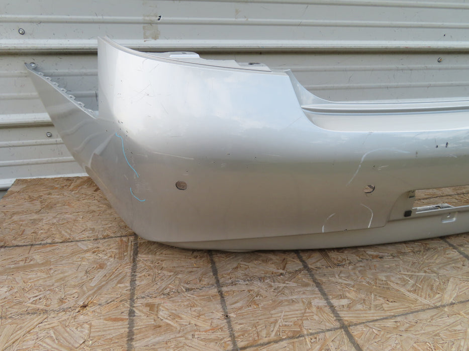 2010-2013 INFINITI G25 G35 Q40 REAR BUMPER COVER OEM