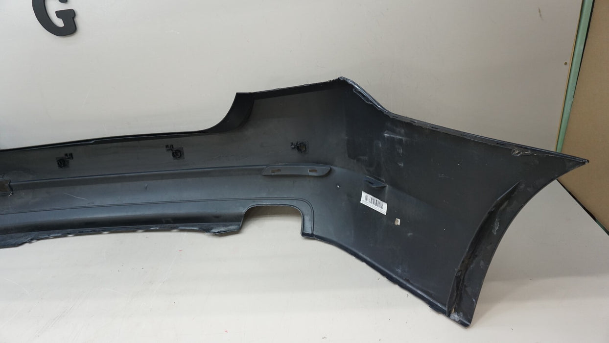 2011-2013 BMW 528I F10 SEDAN REAR BUMPER COVER PANEL W/ SENSOR HOLE OEM 7240372