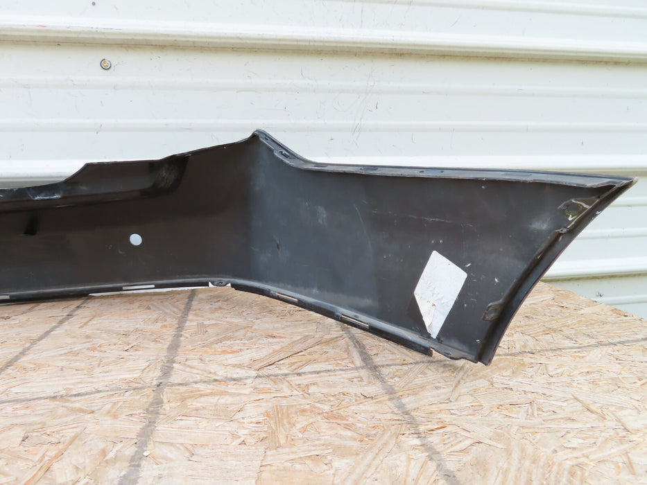 2010-2016 CADILLAC SRX REAR BUMPER COVER PANEL BLACK PLASTIC OEM