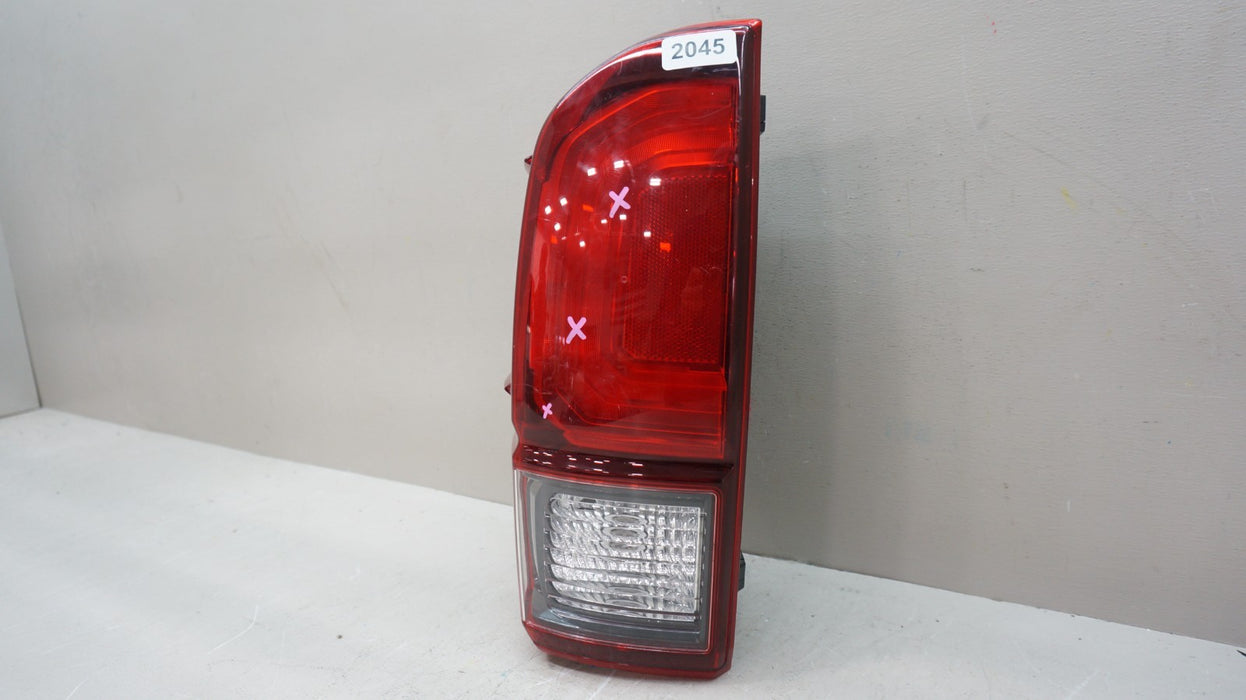 2016-2023 TOYOTA TACOMA REAR LEFT DRIVERS SIDE TAIL LIGHT OEM