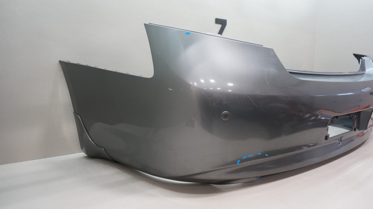 2009-2013 INFINITI G37 SEDAN REAR BUMPER COVER PANEL OEM