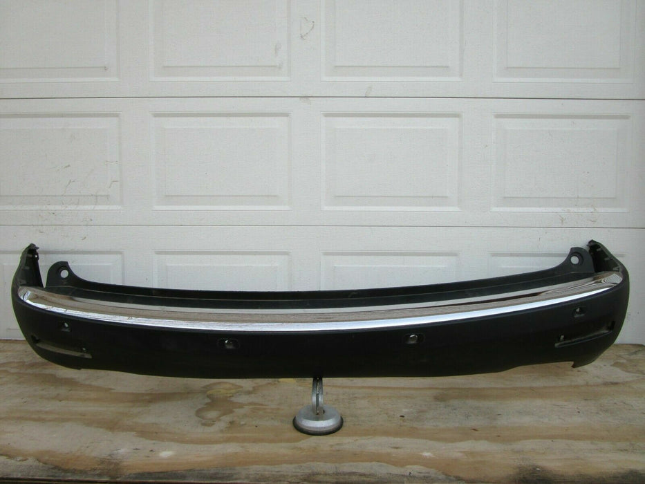 2007-2012 GMC ACADIA REAR BUMPER COVER PANEL PLASTIC W/ SENSOR HOLES OEM