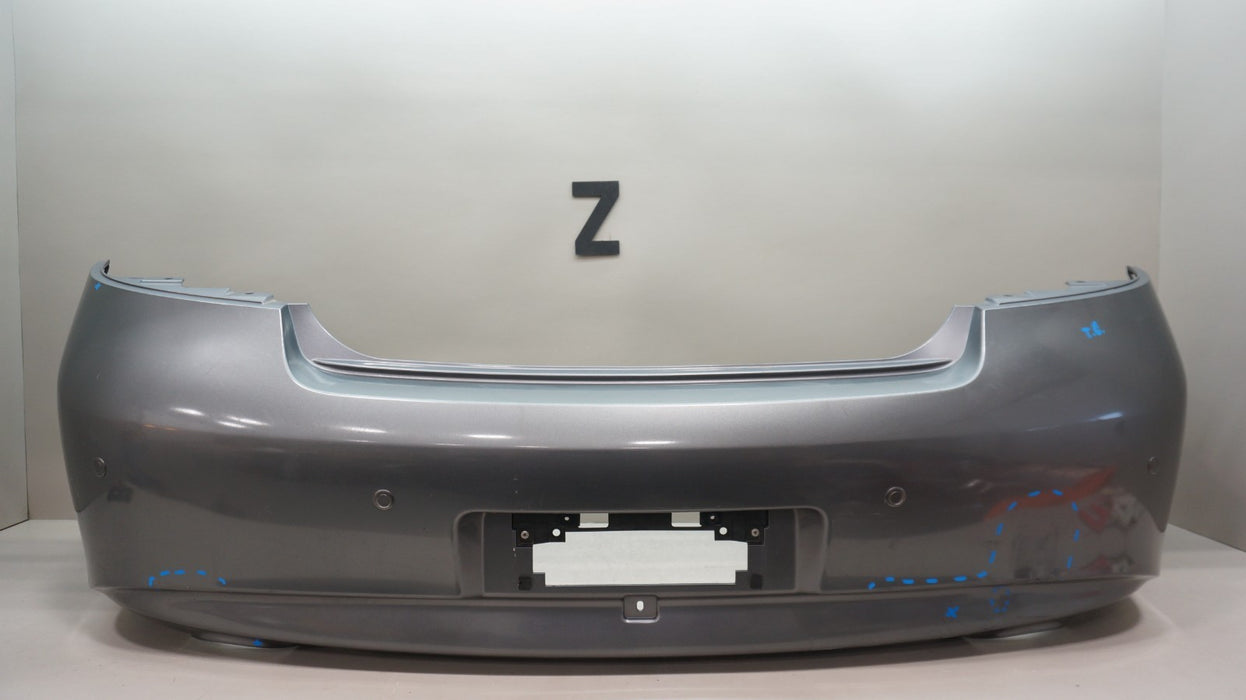 2009-2013 INFINITI G37 SEDAN REAR BUMPER COVER PANEL OEM