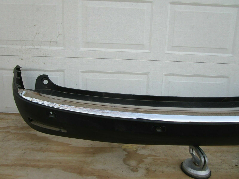 2007-2012 GMC ACADIA REAR BUMPER COVER PANEL PLASTIC W/ SENSOR HOLES OEM