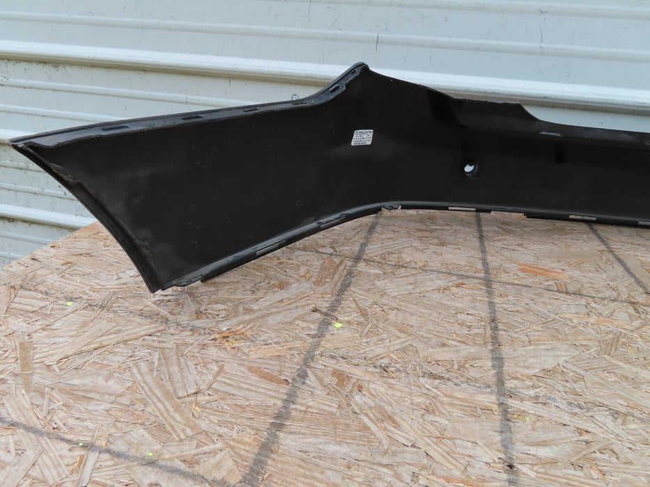 2010-2016 CADILLAC SRX REAR BUMPER COVER PANEL BLACK PLASTIC OEM