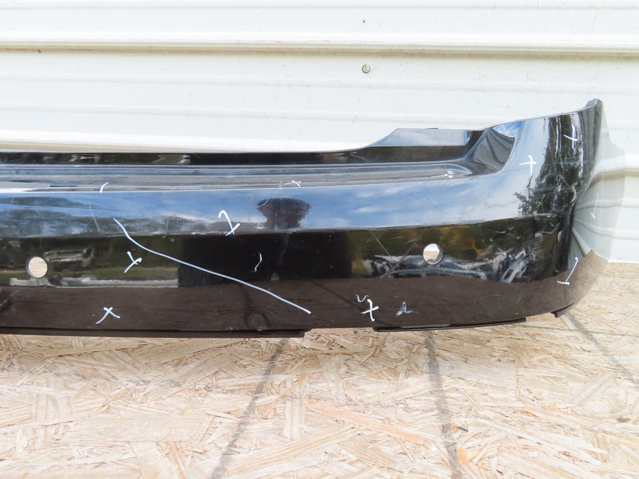 2010-2016 CADILLAC SRX REAR BUMPER COVER PANEL BLACK PLASTIC OEM
